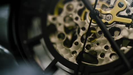Slow-motion-of-watch-with-golden-elements-camera,-moves-in-and-around-watch-at-macro-level