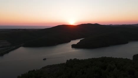 Dramatic-sunset-shadow-on-mountain-near-Adriatic-sea-and-bright-sky-near-horizon