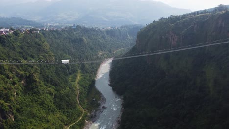 Spectacular-aerial-descending-under-Kushma-suspension-bridge