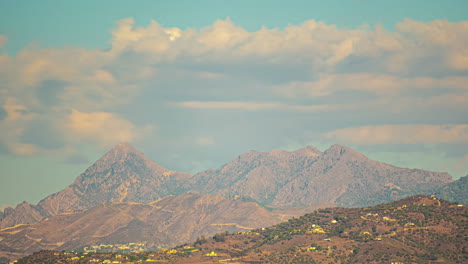 Time-Lapse-Mediterranean-Landscape-Mountains,-Spain-over-blue-sky,-flying-clouds
