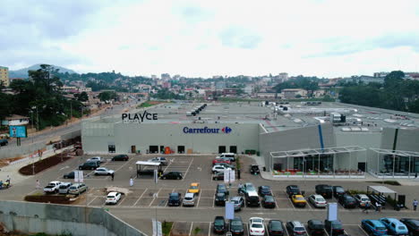 Aerial-view-away-from-the-PlaYce-Yaounde-shopping-center-in-cloudy-Cameroon