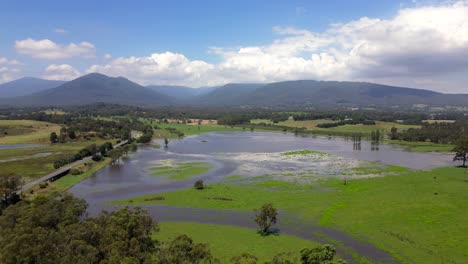 Flooded-farmland-near-Healesville-Victoria,-drone-push-shot
