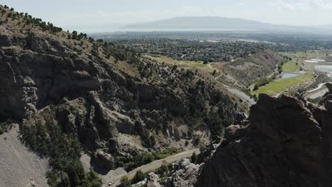 Drone-shot-revealing-the-valleys-lying-beneath-Mount-Timpanogos-in-Utah
