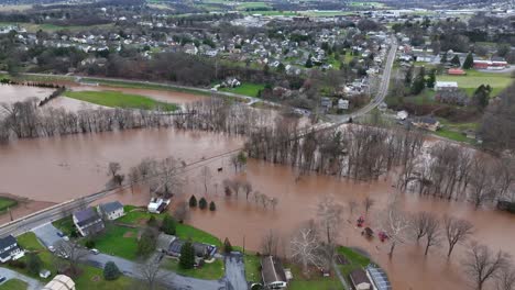 Flooded-trees-and-roads-near-a-suburban-neighborhood,-severe-weather-impact