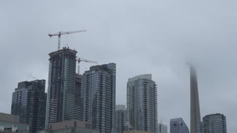 Establishing-Shot-Of-Construction-Cranes-In-Toronto-Skyline