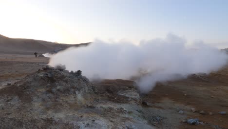 Strong-wind-blowing-steam-away-from-a-sulfuric-smoker-in-Iceland-on-a-sunny-day