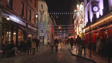 Tourists-in-the-city-center-and-pub-alley-in-the-christmas-time-during-night