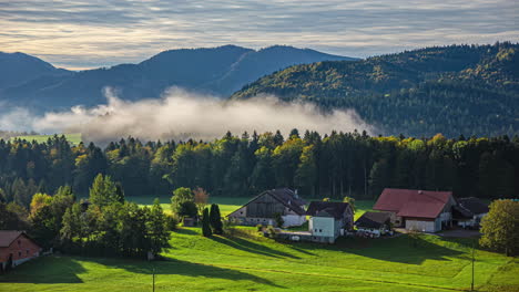 Morning-mist-hugs-the-hills-and-trees-around-a-peaceful-rural-village