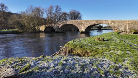 Historic-ancient-bridge-over-The-River-Suir-at-Kilsheelan-Village-Tipperary-on-a-bright-winter-morning