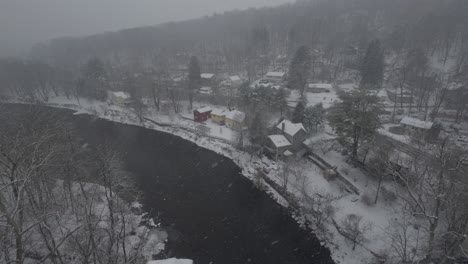 Rosendale,-New-York,-on-a-snowy,-beautiful-winter-day,-during-a-nor'easter,-as-seen-from-the-high-trestle-bridge,-over-the-Rondout-Creek,-on-the-Wallkill-Valley-rail-trail-far-above-the-village