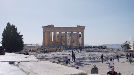 Beautiful-Parthenon-temple-viewed-on-a-sunny-day,-tourists-visiting,-Greece,-Athens