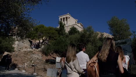 Tourists-visiting-the-Parthenon-temple-in-Athens,-Greece-tourist-places,-travel-guide