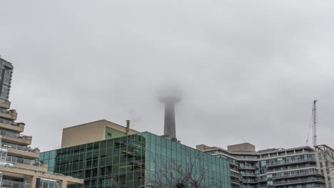 Clouds-Covering-Landmark-Cn-Tower-In-Toronto,-Canada
