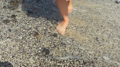 Barefoot-female-enjoys-beach-and-sea-water-of-Tenerife-island,-feet-shot