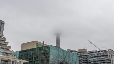 Clouds-Hiding-Cn-Tower-In-Downtown-Toronto,-Time-Lapse