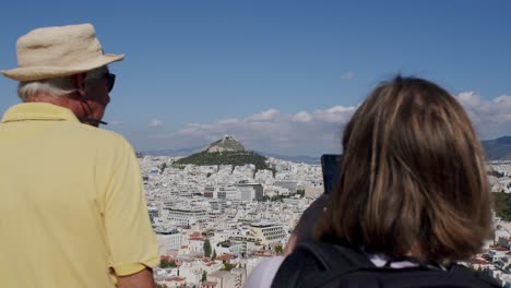 Acropolis-with-the-old-town-of-Athens-in-the-foreground-watched-by-tourists