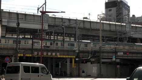 Tokyo-Metro-Tozai-Line-Departing-Station-On-Elevated-Train-Track-In-Tokyo