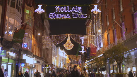Cinematic-establisher-of-Christmas-shopping-street,-people-strolling