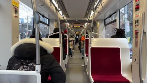 Inside-Toronto-Transit-Streetcar-TTC-during-winter,-modern-interior-view