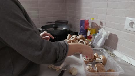 The-Hands-of-a-Woman-Cutting-and-Cleaning-the-Mushroom---Close-Up