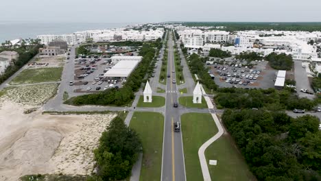 view-going-west-of-East-entrance-of-Alys-beach-town-with-active-transit-with-seaside-on-left-and-land-and-wood-side-on-the-right