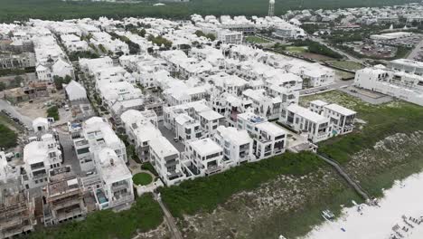 turning-to-right-motion-town-of-Arys-beach-with-lots-of-white-houses-and-buildings-with-some-under-construction