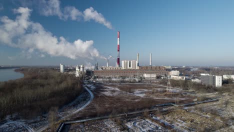 Aerial-lifting-shot-of-air-pollution-from-a-thermal-power-plant-in-Poland