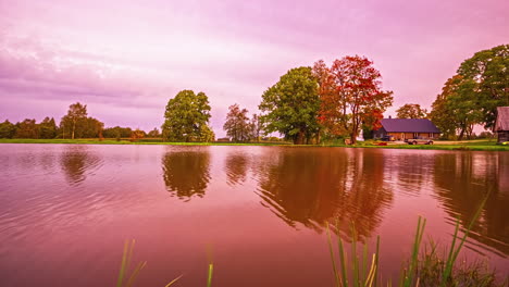Surrealistic-timelapse-of-colorful-sky-reflected-by-a-tranquil-lake-in-Europe