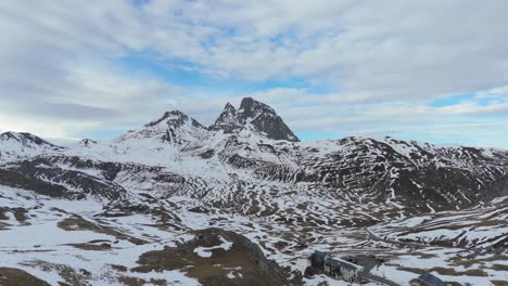 Drone-advancing-towards-the-snowy-mountain-of-Pic-du-Midi-d'Ossau-in-France