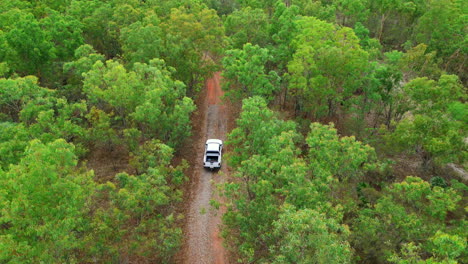 Drone-areal-footage-of-a-utility-vehicle-driving-through-a-dirt-roan-in-outback-Australia