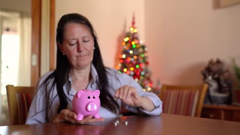 A-Woman-is-Depositing-Coins-Into-a-Piggy-Bank
