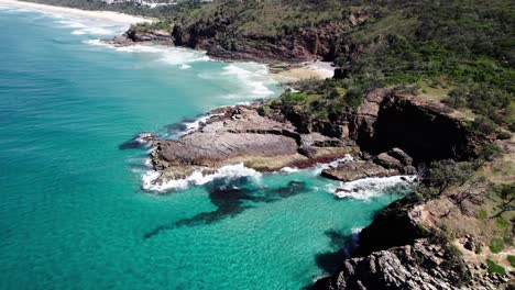 Aerial-View-Of-Cliffs-And-Beach-In-Noosa-Shire,-Queensland,-Australia---Drone-Shot