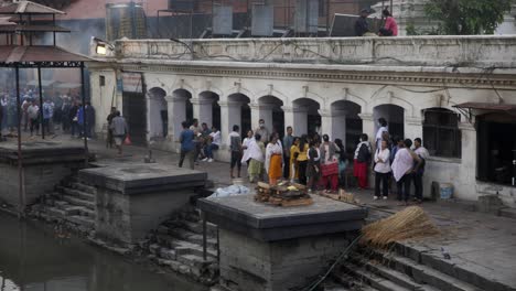 Family-members-gather-for-cremation-along-the-Bagmati-River