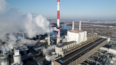 Bird's-eye-view-of-the-heat-and-power-plant-next-to-the-Vistula-River-in-Warsaw,-Poland