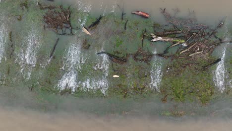 Aerial-birdseye-view-of-flood-waters-overflowing-a-levy-along-the-Waal-River-near-Gorinchem-Netherlands-in-the-winter-of-2024-after-heavy-rains-lash-Northern-Europe