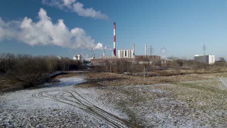 High-rising-aerial-from-a-power-plant-powering-the-city-during-cold-winter-months