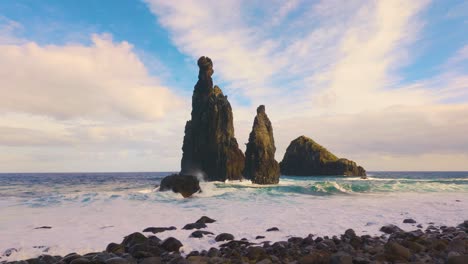 Wide-shot-showing-rock-formation-at-shore-of-Madeira-Island-during-sunset-time---slow-motion