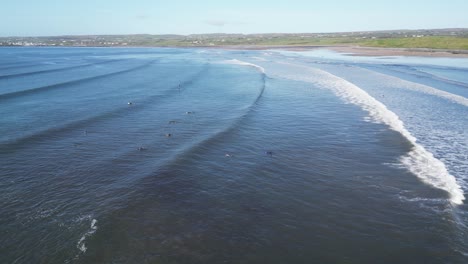 Aerial-shot-overhead-a-group-of-surfers-waiting-on-waves-at-Doughmore-Bay