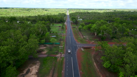 Drone-areal-footage-following-a-car-alone-a-rural-road