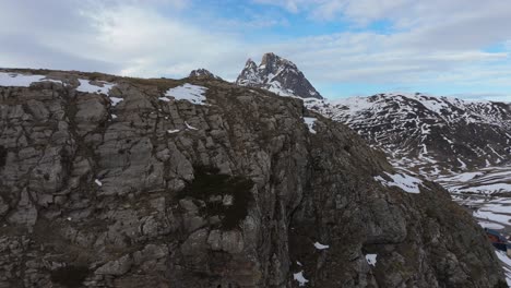 Drone-revealing-movement-the-snowy-mountain-Pic-du-Midi-d'Ossau-in-France-from-the-Portalet-sky-station-in-Spain