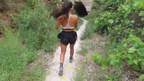 Woman-taking-videos-while-hiking-in-the-woodlands-of-the-Cappadocian-Hiking-trail,-located-in-the-district-of-Fethiye,-Muğla-Province,-Turkey