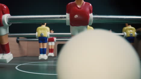 Table-level-view-of-foosball-players-kicking-the-ball