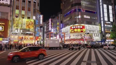 Slow-motion-establishing-shot-of-Shinjuku-crossing-and-red-Kabukicho-crossing-gates-in-Tokyo