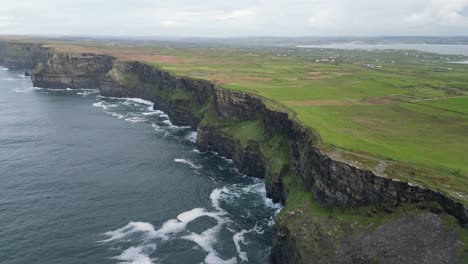 Aerial-establishing-shot-of-the-rocky-ridge-line-at-the-Cliffs-of-Moher