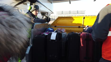 Stuttgart,-Germany---December-29th,-2018:-Employees-talking-at-the-suitcase-venture-at-the-airport,-Stuttgart,-Germany