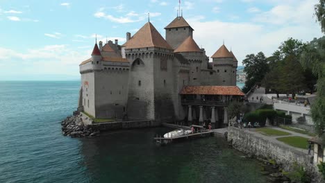 Drone-Boom-and-Tilt-Movement-of-Chillon-Castle-on-Lake-Geneva