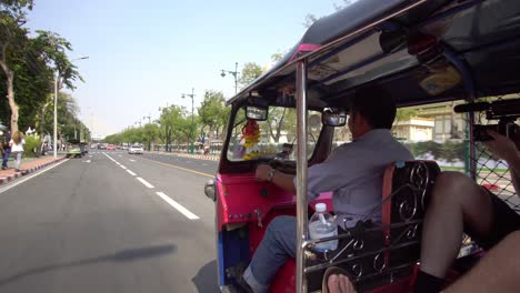 Tuk-Tuk-on-Street-of-Bangkok,-Thailand,-Traditional-Public-Transportation,-Cinematic-POV