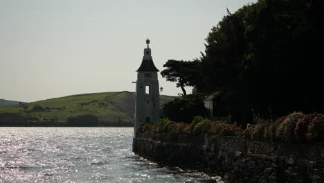 Lighthouse-On-The-Coast-Of-Portmeirion,-An-Italian-Style-Village-In-North-Wales,-UK