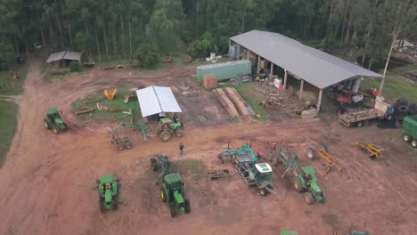 Aerial-View-of-Heavy-Machines-and-Storage-Unit-in-Forestry-Farm-in-Countryside-of-Paraguay