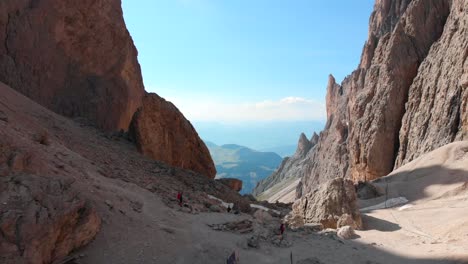 Drone-Flying-Forwards-over-the-Summit-of-Sassolungo-Langkofel-in-the-Italian-Dolomites